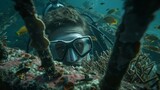 Through thick goggles a diver surveys a shipwreck covered in vibrant coral and schools of fish with the promise of valuable artifacts and relics tered a its remains.