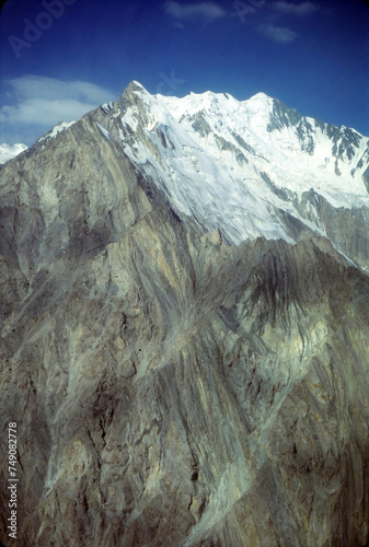 Steep mountain peak and glacier in the Pamirs photo