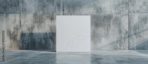 A room with concrete walls, a white door, and a blank picture frame. There is a luxury white chair on a wooden parquet floor and white decorative plaster walls.