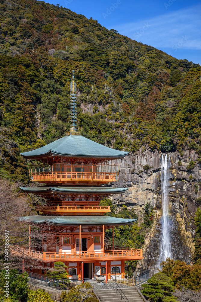 Three story pagoda of Seiganto-ji Tendai Buddhist temple in Wakayama Prefecture, Japan with Nachi Falls Three story pagoda of Seiganto-ji Tendai Buddhist temple in Wakayama Prefecture, Japan with Nachi Falls