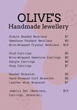 Showcase artisan jewelry, soft pink backdrop with price list