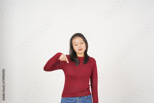 Young Asian woman in Red t-shirt Pointing down at copy space isolated on white background