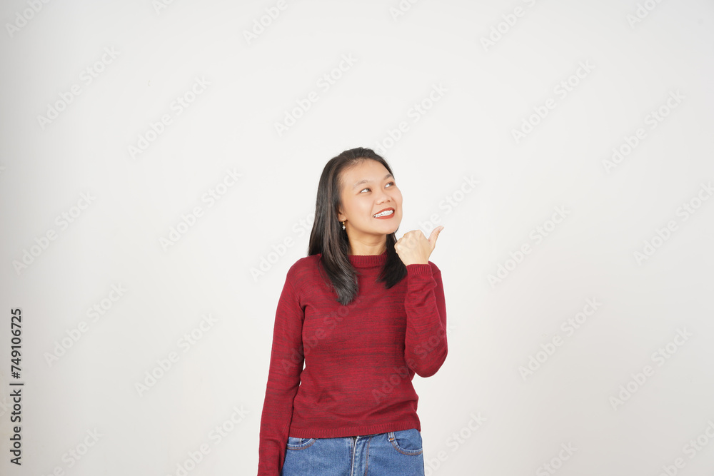Young Asian woman in Red t-shirt Pointing side at copy space with thumb isolated on white background Young Asian woman in Red t-shirt Pointing side at copy space with thumb isolated on white background