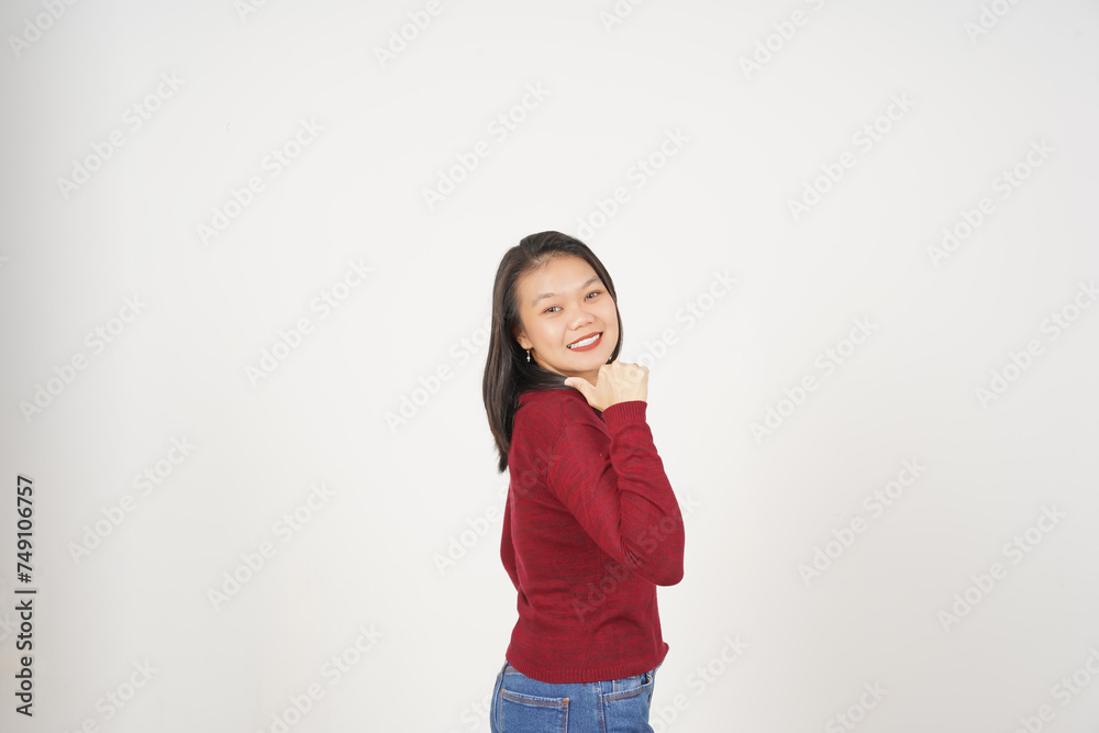 Young Asian woman in Red t-shirt Pointing side at copy space with thumb isolated on white background Young Asian woman in Red t-shirt Pointing side at copy space with thumb isolated on white background
