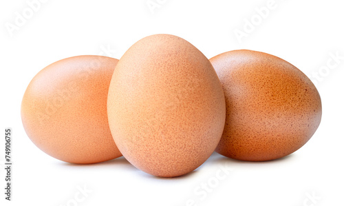 Front view of three fresh chicken eggs in stack isolated with clipping path and shadow in png file format