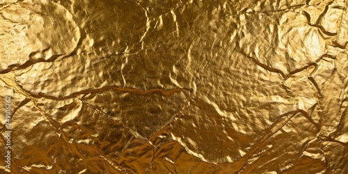 Abstract grunge gold metallic, foil background, wallpaper texture. Great as banner