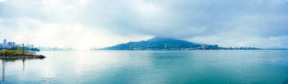 Taipei, Taiwan, Republic of China, 01 22 2024: Clean Tamsui river in a raining day in winter