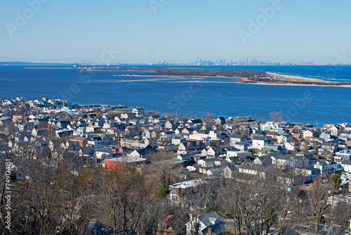 Sandy Hook, the Verrazzano Bridge and the New York City skyline in the distance viewed from the Navesink Twin Lights property above the Highlands section on New Jersey,-02
