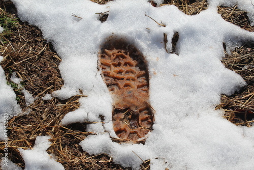 Muddy Boot Print in the Snow
