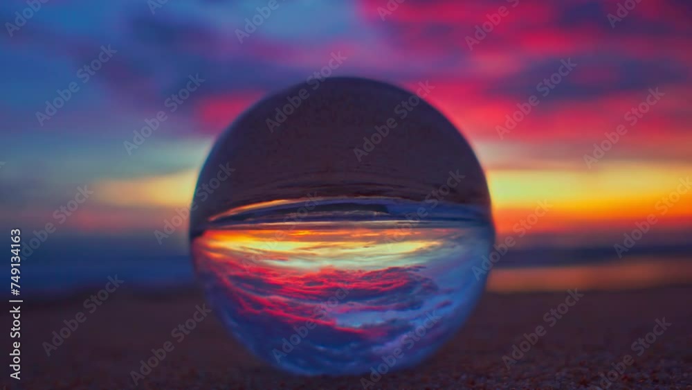 Amazing view of colorful cloud in sky of sunset inside crystal ball. .The natural view of the sea and sky in beautiful sunset on Phuket beach. .AN image for a unique and creative travel. Amazing view of colorful cloud in sky of sunset inside crystal ball. .The natural view of the sea and sky in beautiful sunset on Phuket beach. .AN image for a unique and creative travel.