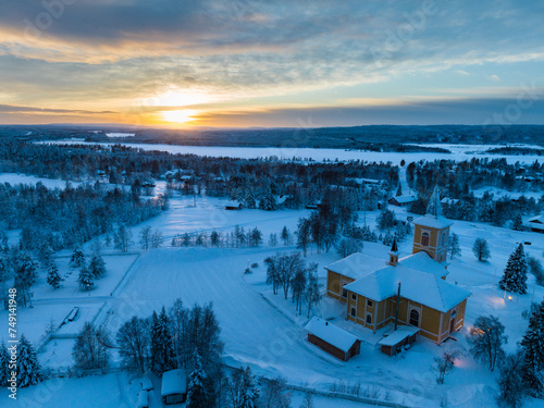 Aerial view of Muonio at sunset in winter, in snow, located in Lapland of Finland.