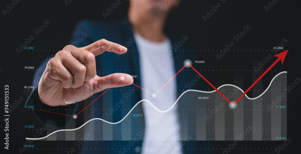 Businessman pointing graph corporate future growth financial, strategy, analysis, plan Business development to success and growing growth concept. Businessman pointing graph corporate future growth financial, strategy, analysis, plan Business development to success and growing growth concept.