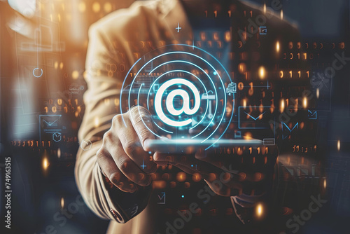Businessman clicking on email icon, contact by email concept photo
