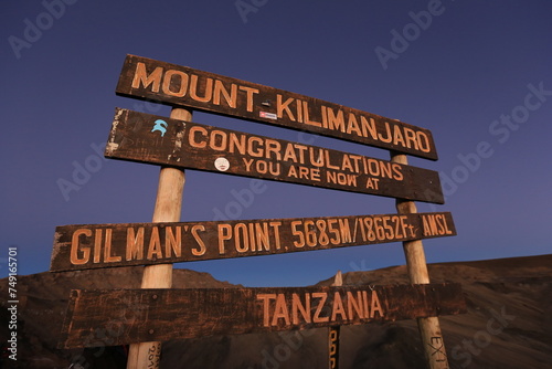 the sign of gilmans's point on the way up to mount kilimanjaro photo