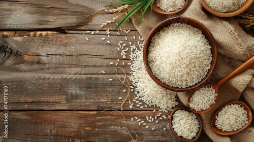 soaked white rice in a wooden bowl - flat lay composition in top view photo