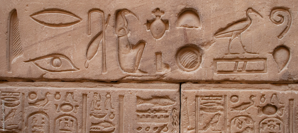 Ancient egyptian carvings and hieroglyphs at the temple of Horus in Edfu, Aswan, Egypt Ancient egyptian carvings and hieroglyphs at the temple of Horus in Edfu, Aswan, Egypt