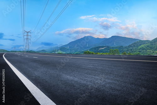 Empty asphalt road and mountains background © zhao dongfang