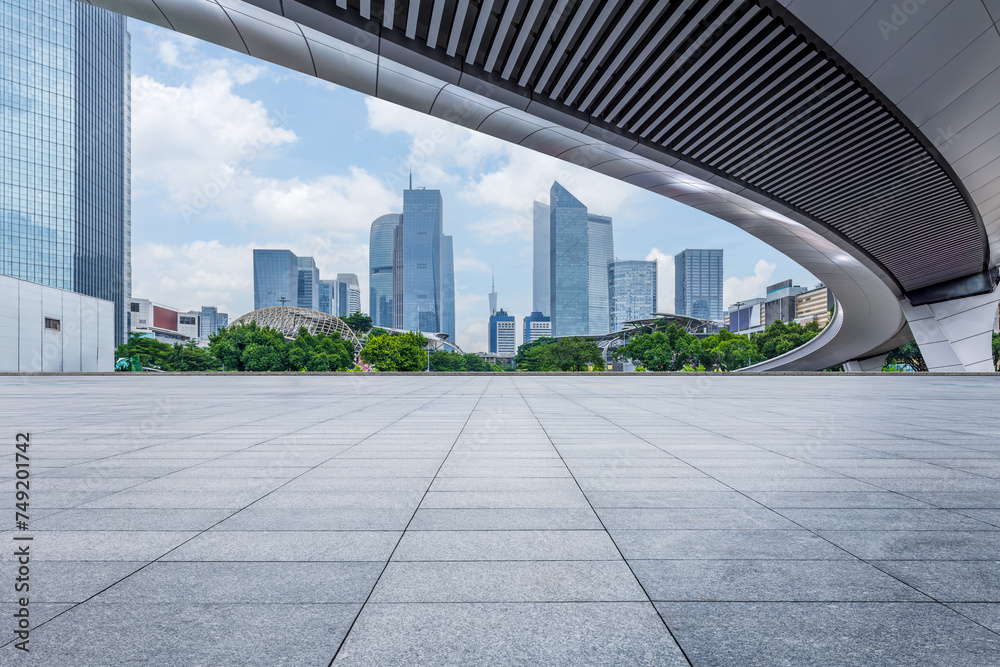 Empty square platform and commercial building background Empty square platform and commercial building background