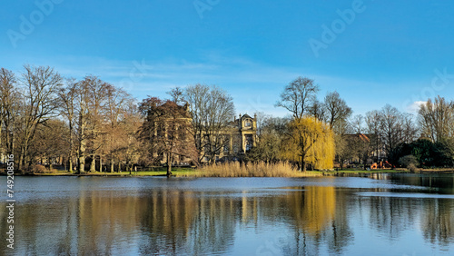 Hanover Maschpark with beautiful tree and nature reflection in the big lake water