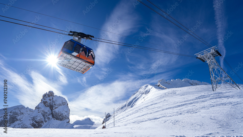 Sunlit Snowy Peaks and Ski Cabin: A View from the Italian Alps Sunlit Snowy Peaks and Ski Cabin: A View from the Italian Alps