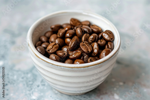 toasted coffee beans in a white cup