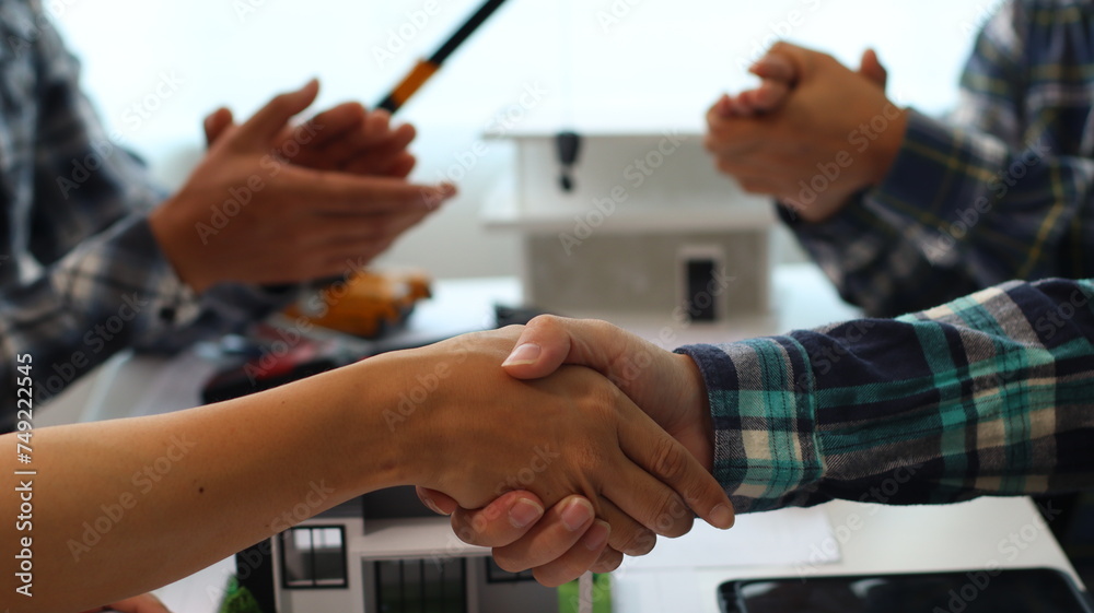 Closeup of hands engineer and architect team discussed about construction and architectural drawings works. Closeup of hands engineer and architect team discussed about construction and architectural drawings works.