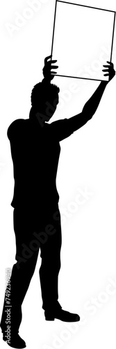 Protestor or demonstrator at a demonstration march, picket line or strike protest rally in silhouette. Holding up a banner or picket sign board placard.