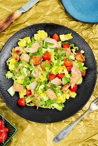 Salad with meat and fresh vegetables.