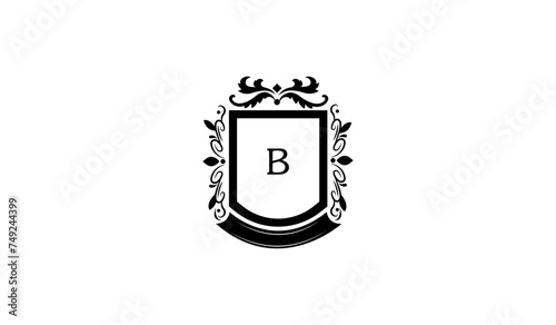 Illustration of a Shield With Crown Alphabetical Logo