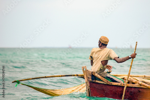 Fisherman in Zanzibar looking over his shoulder