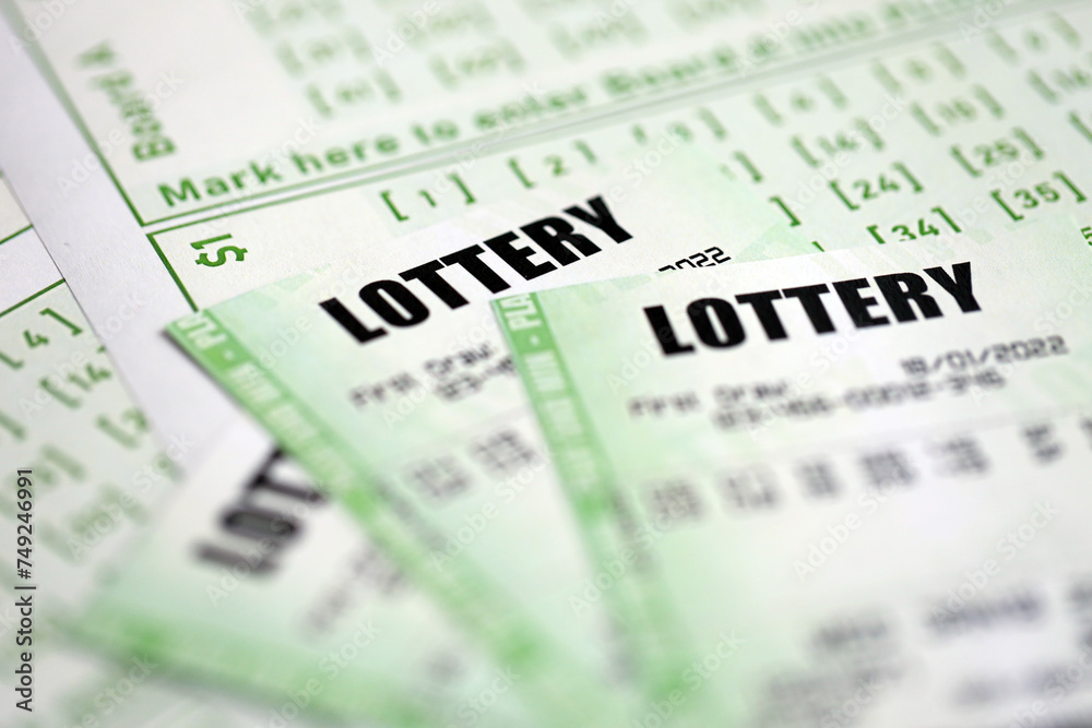Green lottery tickets and blank bills with numbers for playing lottery close up Green lottery tickets and blank bills with numbers for playing lottery close up