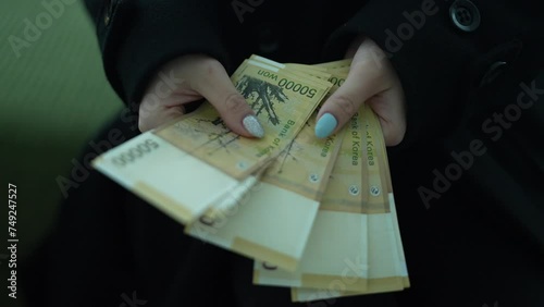 Counting South Korean 50,000 Won Banknotes