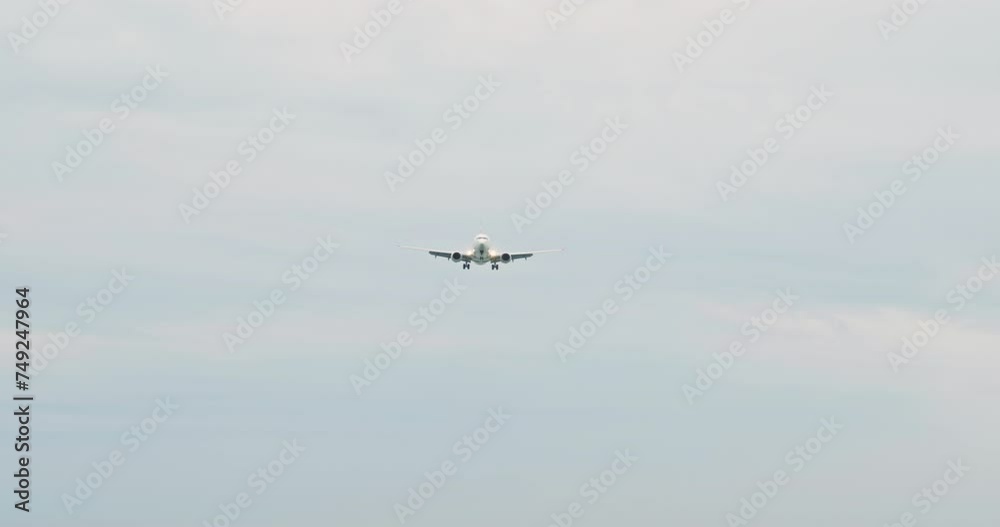 View of majestic airplane flying in skyscape. White air vehicle on journey. Concept of transportation. View of majestic airplane flying in skyscape. White air vehicle on journey. Concept of transportation.