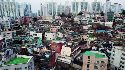 Drone Shot Capturing Coexistence of Old Houses, Apartments, and Busan's Urban Landscape