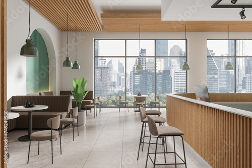 Photography Stylish cafe interior with chairs and table, couch and cash desk with window