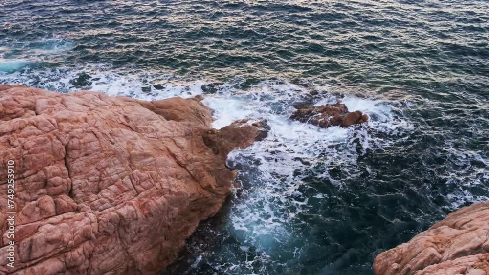 Crashing waves on the sea and rocks