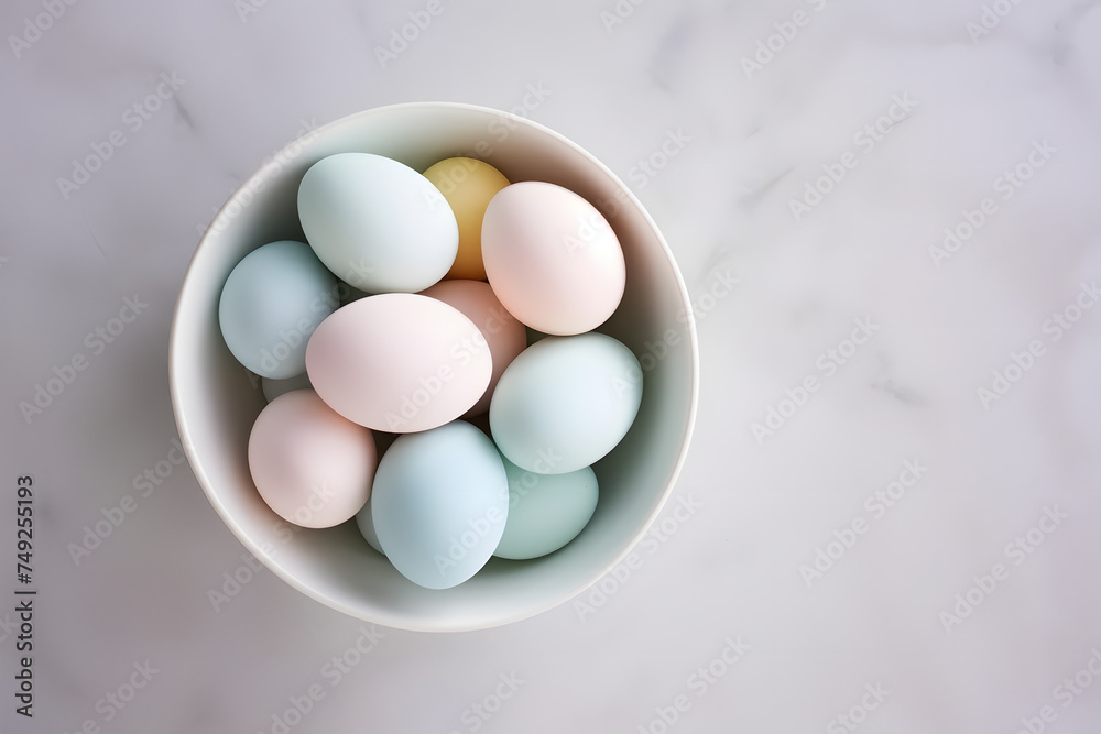 Bowl with pastel colored easter eggs in bowl with copy space