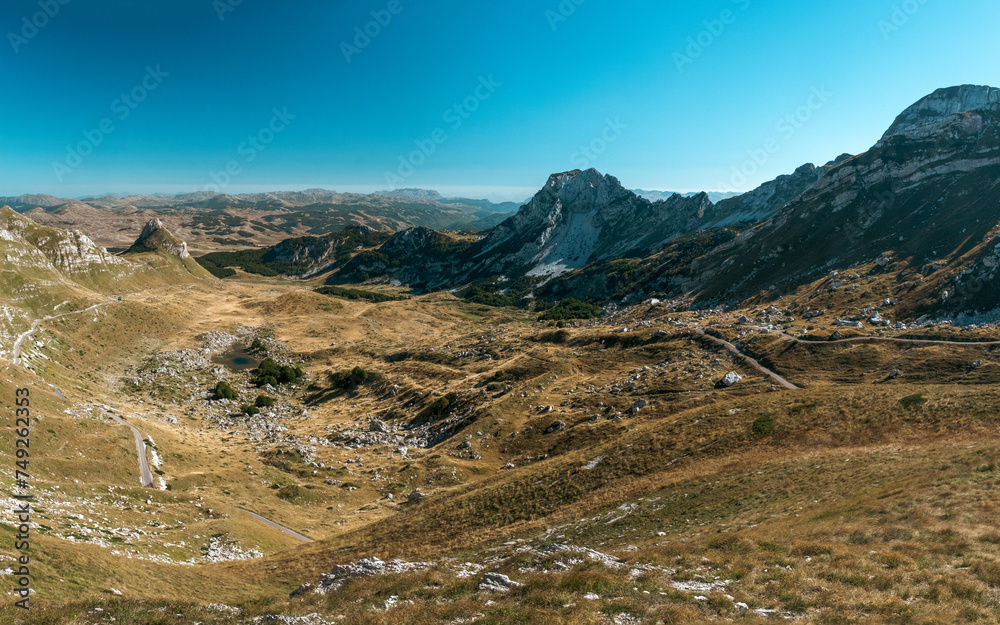 Panorama of the mountains with road going through the valley, Durmitor, Montenegro