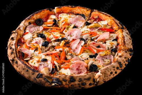 Italian kitchen pizza with ham, cheese, mushrooms, onions, olives, sweet peppers, tomato sauce and spices isolated on black.