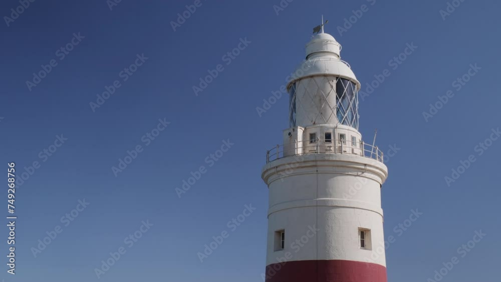 Europa Point Lighthouse at the Europa Point in Gibraltar with the Gibraltar strait in background Europa Point Lighthouse at the Europa Point in Gibraltar with the Gibraltar strait in background