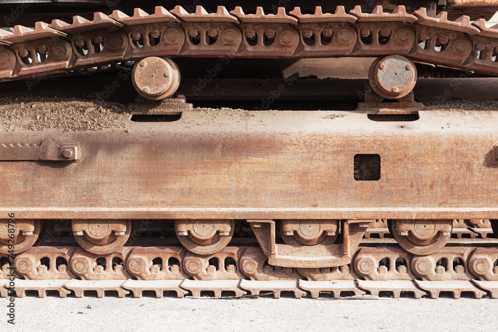Close-up of metal tracks of a crawler crane. Chassis tracked vehicles.