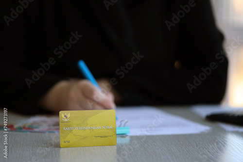 Indonesian golden social security card originally called Kartu perlindungan sosial. Card for financial support photo