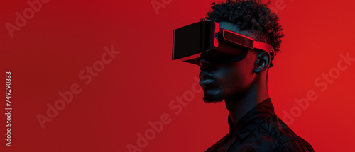 The image portrays an individual lost in the virtual experience with a VR headset on, the red hue giving an intense aura photo