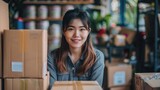 Startup small business entrepreneur SME freelance asian woman working with box, Asian woman small business owner, online e-commerce marketing box delivery, SME telemarket overtime stress concept