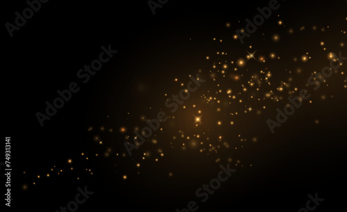  background effect of gold Dust particles that can be used for luxury greeting cards. The texture sparkles and creates a star dust explosion on a transparent background. 