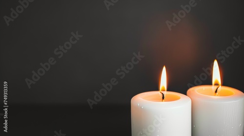 Mockup of two lighted white candles  space on the right for writing