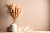 Pampas grass in ceramic vase near studio wall background, space for text
