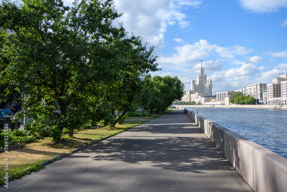 View of the Kotelnicheskaya embankment of the Moscow River. Characteristic architectural structures of the Stalinist Empire style surrounded by later Soviet style and modern solutions.