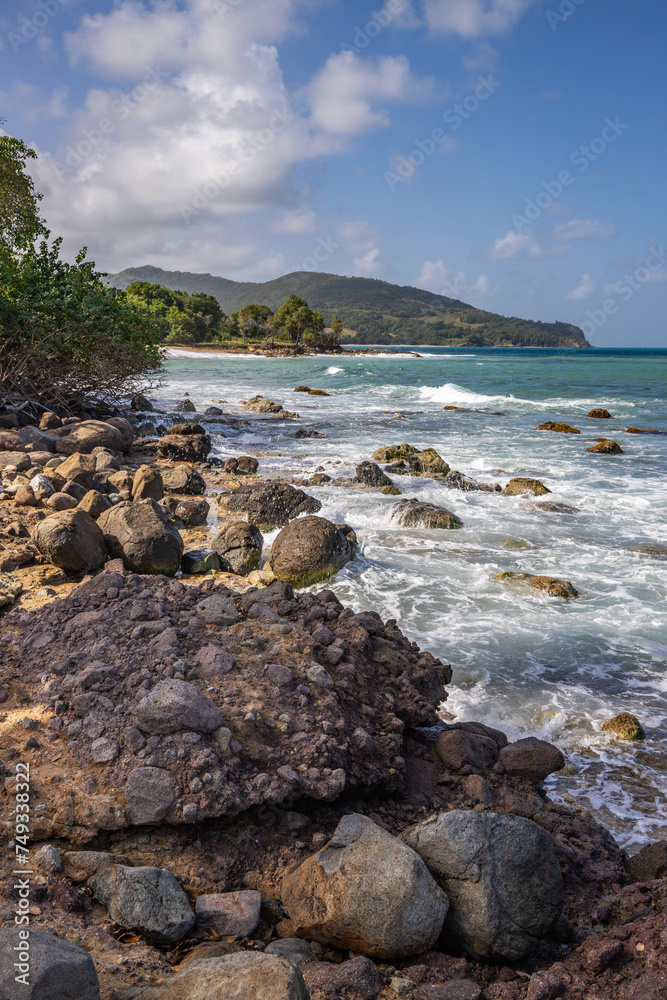 Nature in a special landscape. A rocky coast by the sea. Great landscape shot of cliffs in the Caribbean, the waves breaking against the island of Guadeloupe in the French Antilles.