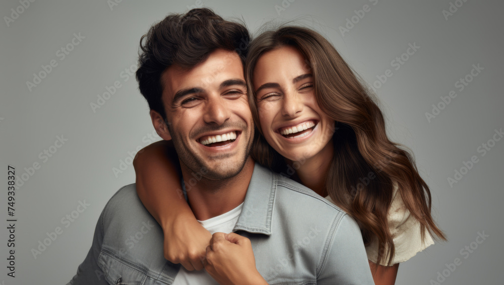 Studio portrait of a happy loving couple hugging together Studio portrait of a happy loving couple hugging together